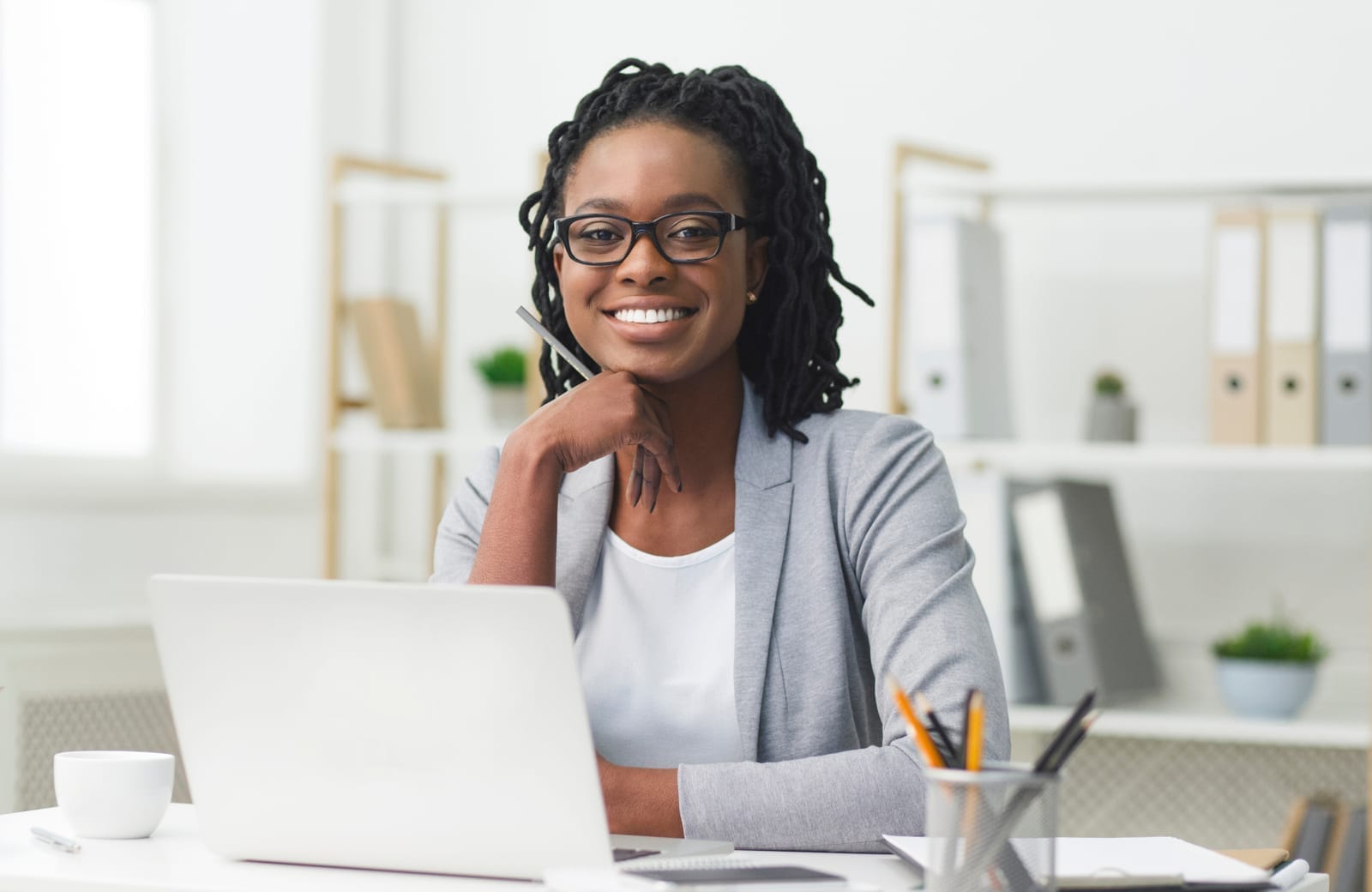 Confident small-business owner working at her desk